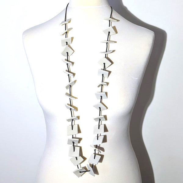 Lightweight necklace with neoprene squares and knotted spacing