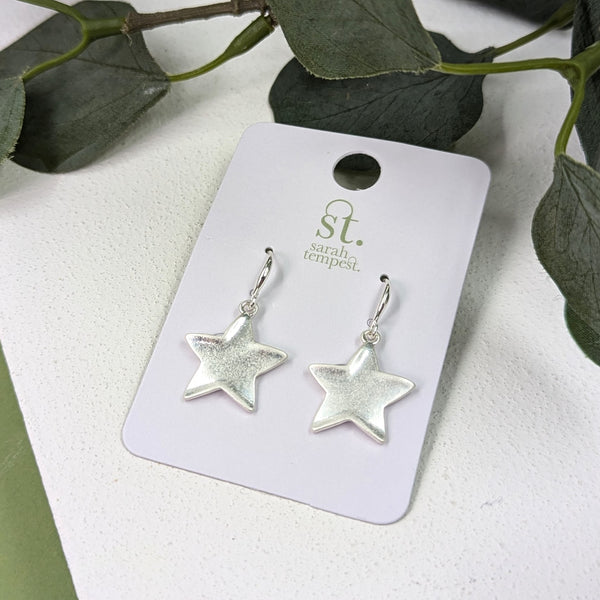 Fish hook earrings with worn silver stars