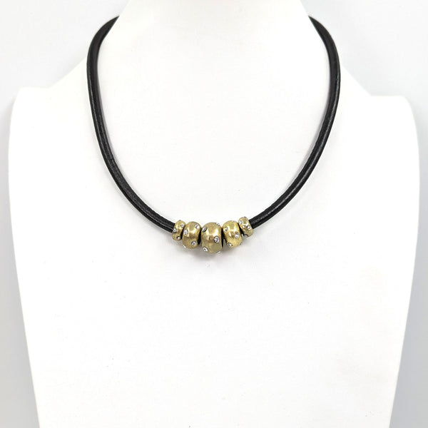 Simple leather necklace with donut beads