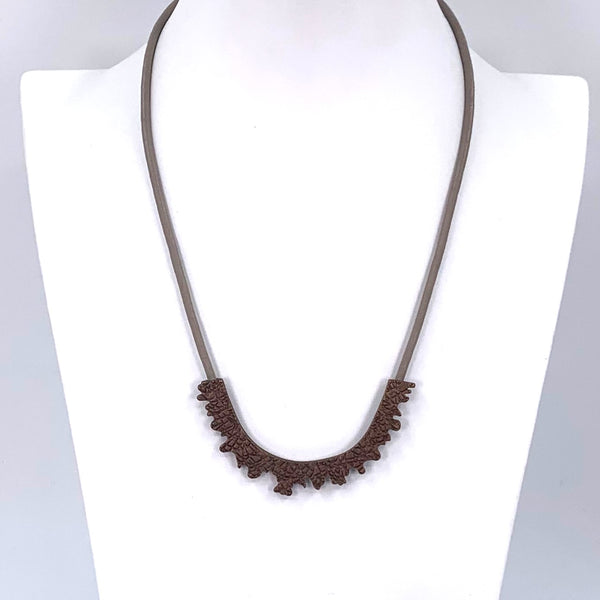 Short leather necklace with irregular matte chocolate feature