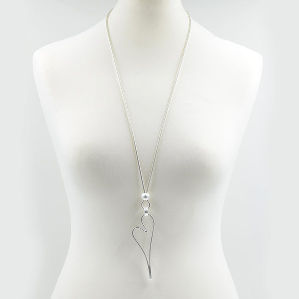 Elongated cut out heart pendant on long snake chain