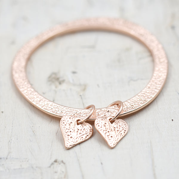 Patterned slim bangle with twin heart drops