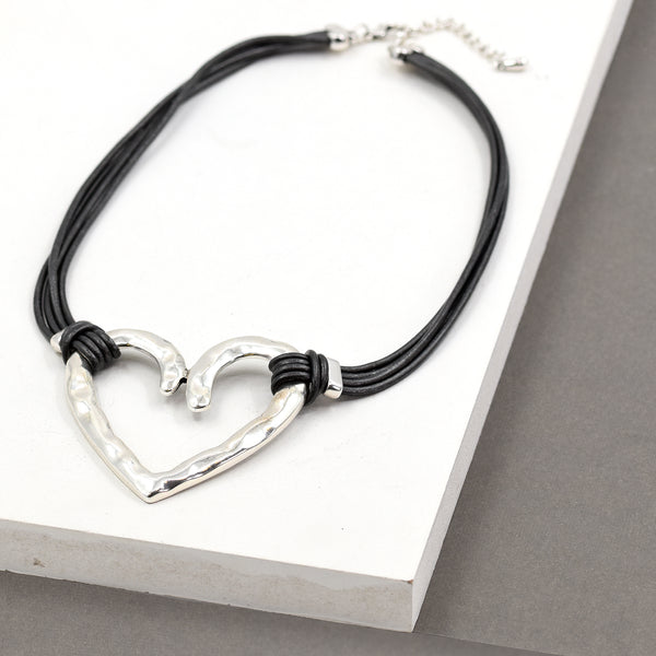 Short multi cord leather necklace with beaten effect heart