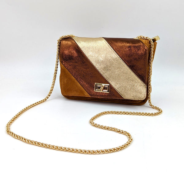 Suede clutch bag with metallic leather diagonal panels with adjustable rope chain strap and  twist clasp