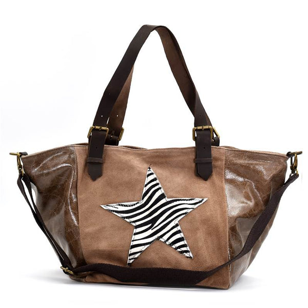 Zebra print star on leather and suede beach/weekend bag