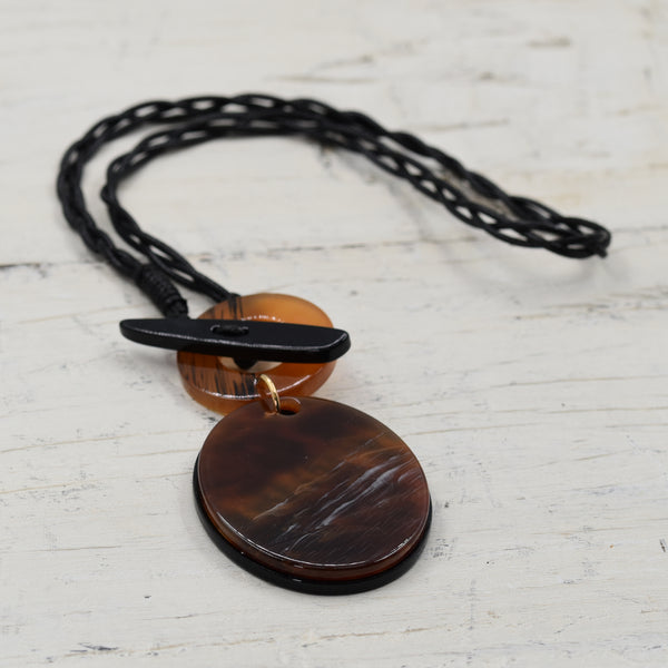 Oval brown marble resin pendant with T-bar feature on medium