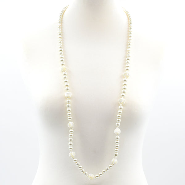 Long pearl necklace interpaced with varied pearl detail