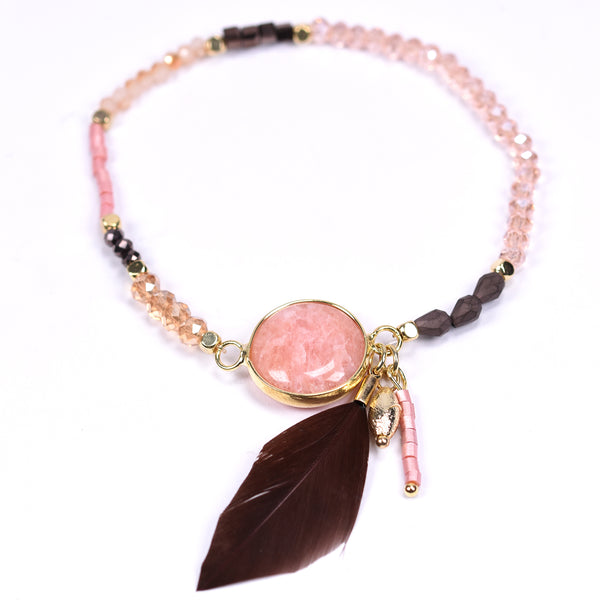 Delicate beaded bracelet with feather