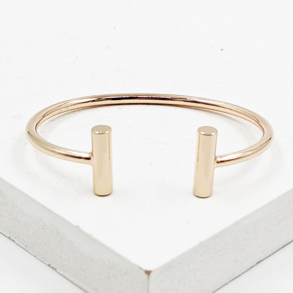 Rose gold open bangle with bar details