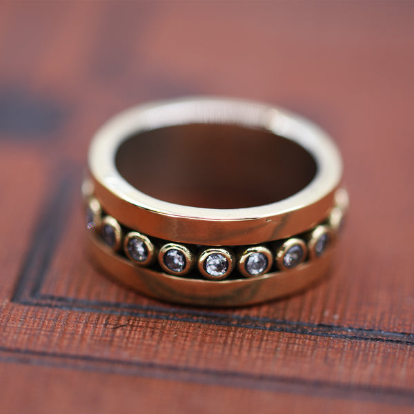 Central coloured stone band ring 