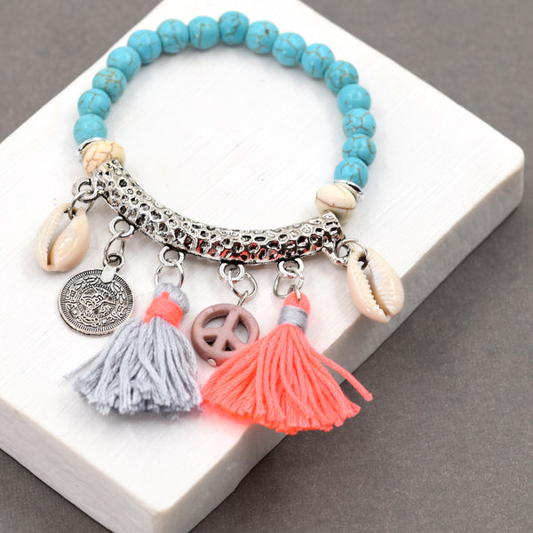 Blue beaded bracelet with multi charms