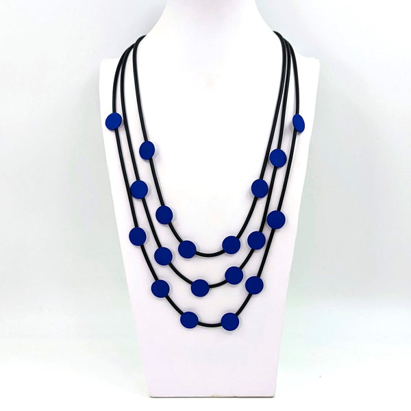 Triple strand long neoprene necklace with disc components