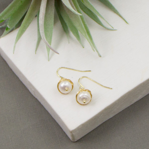 Real pearl drop earrings with gold surrounding