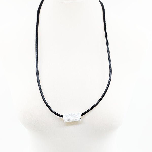 Solid rectangle component on leather necklace