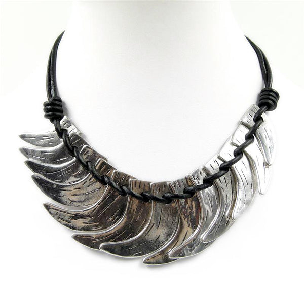 Layered crescent shapes on short leather necklace