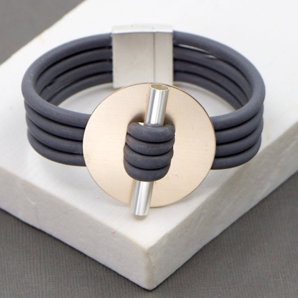 Neoprene bracelet with disc and bar detail and magnetic clasp