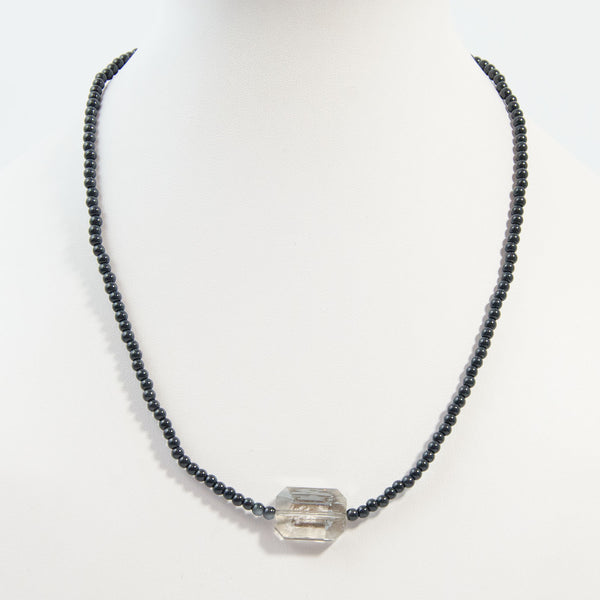 Simple beaded necklace with central cut glass bead