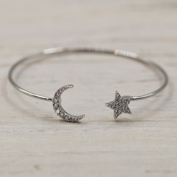 Delicate open bangle with lucky horseshoe and star