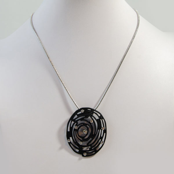 Irregular swirl pendant with crystal detail