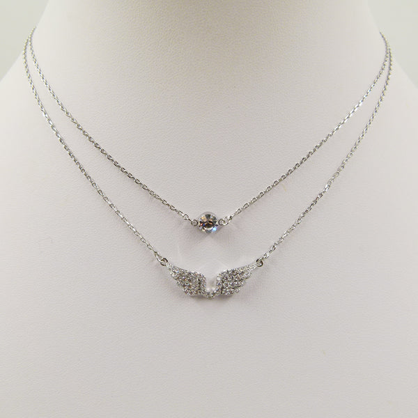 Delicate wing pendat with crystal on short necklace chain