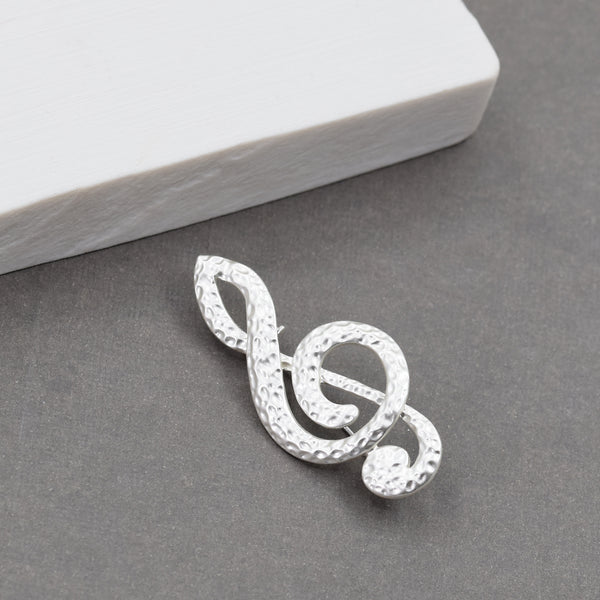 Soft hammered musical note brooch