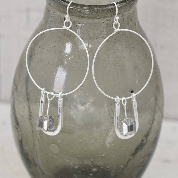 Silver hoop earring with stone drop element