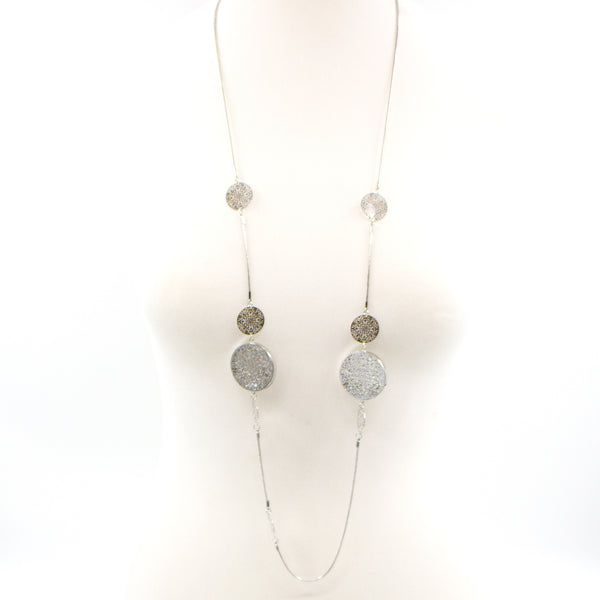 Filigree disc components on long necklace