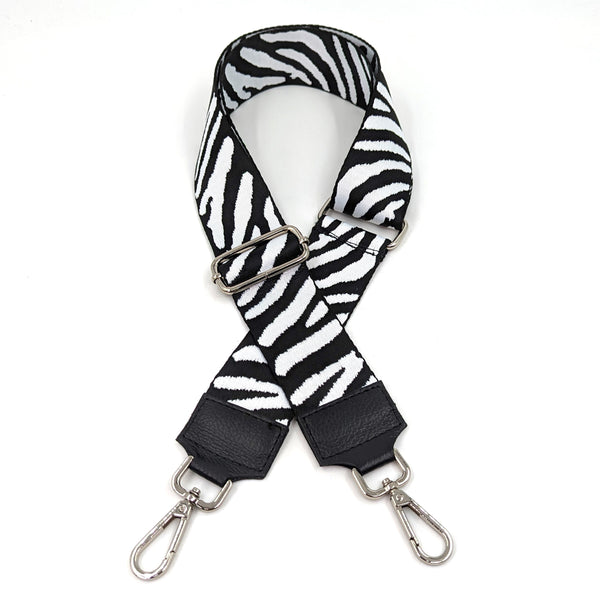 Zebra woven adjustable bag strap with silver hardware and leather stitched ends