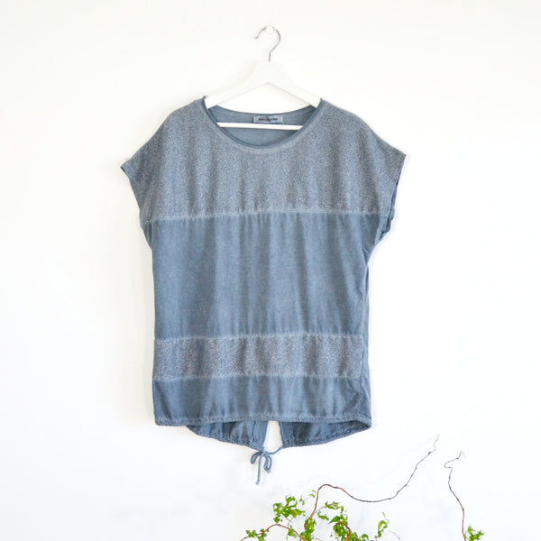 Vintage wash top with metallic panels and drawstring hem