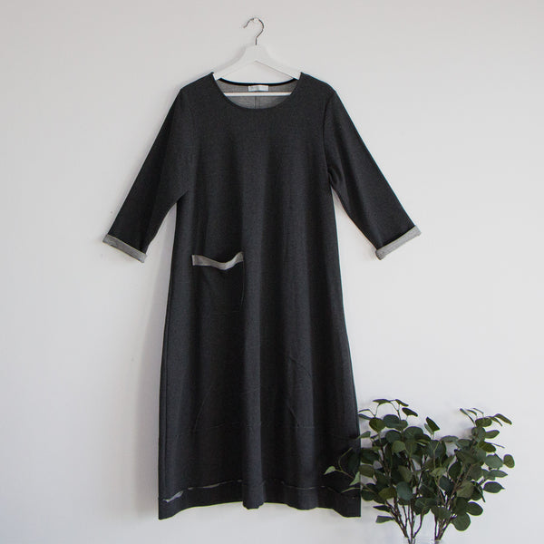 Cotton dress with 3/4 sleeves panel stitching at bottom with pocket detail