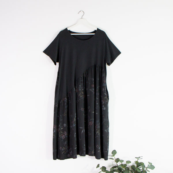 Extra large smock style short sleeve dress with diagonal plain top and floral print lower section