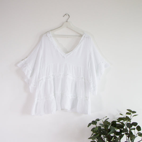 Prairie style top with lace detail and fluted sleeves