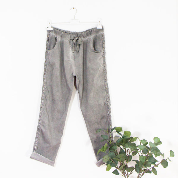 Stretchy vintage wash trousers with drawstring waist pockets and eyelet crystal silver trim