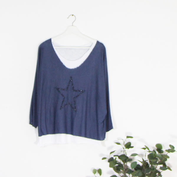 Fine knit top with embroidery star outline and white separate undervest