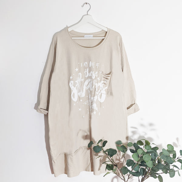 Roomy relaxed long star print top with raw edge pocket