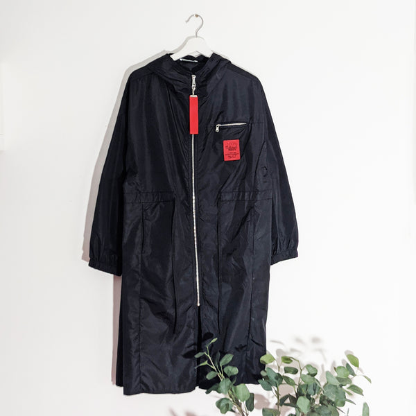 Long length hooded jacket with zip pocket and red zip pull