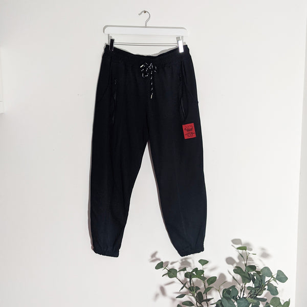 Jogger pants with front zip detail and red label