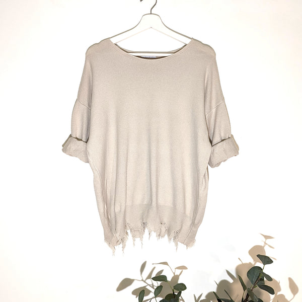 Super soft jumper with fashionable distressed hem line