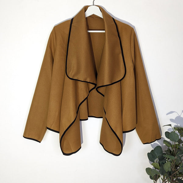 Waterfall lapel short camel jacket with black edging