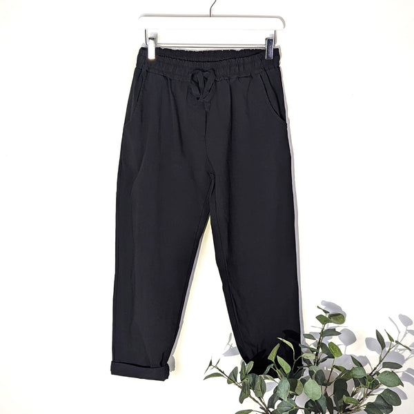 Substantial plain trousers with elasticated waist band and pockets