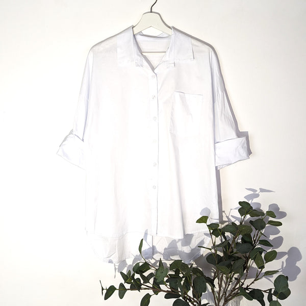 Plain white larger long shirt with button detail on back (M)