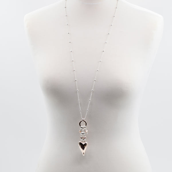 Rose gold heart pendant with small heart charms on variegate