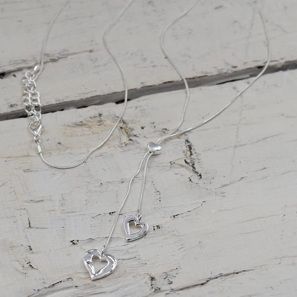 Little heart shape pendants on a lariette style necklace