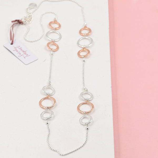 Long rope style necklace with mixed plated circles