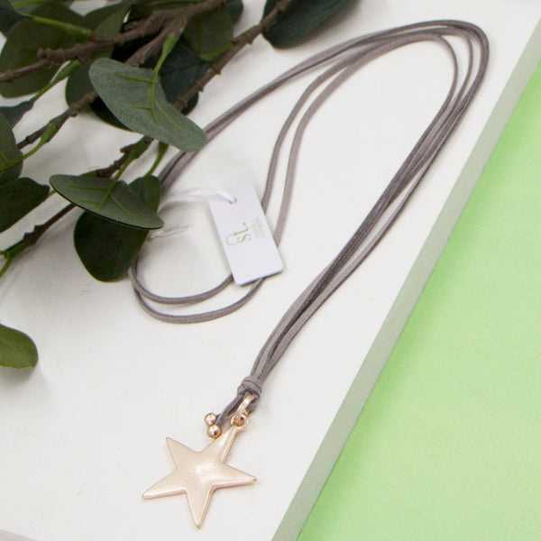 Star pendant on grey suede long necklace