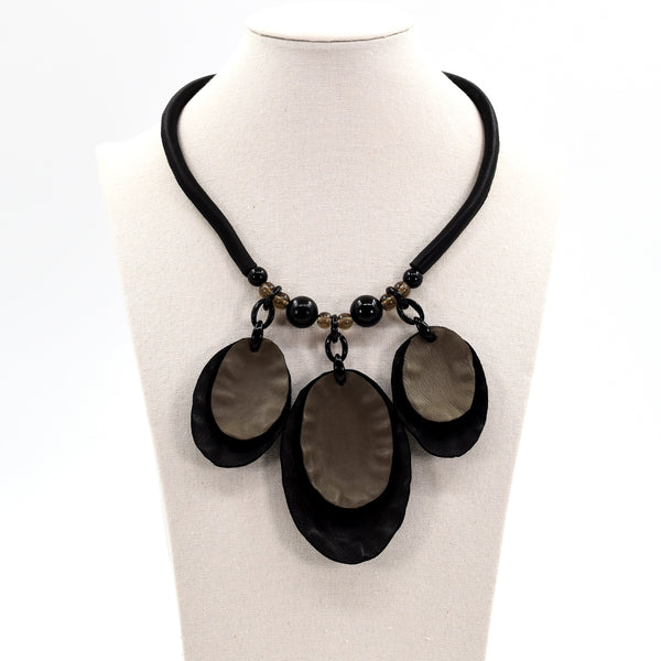 Short statement necklace with three large oval soft leather components