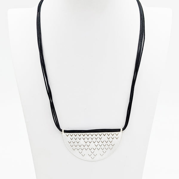 Statement lasercut crescent pendant on multi waxcord necklce