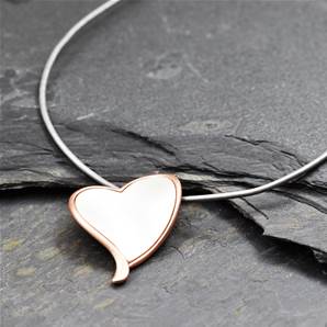 Delicate metal mix heart on leather