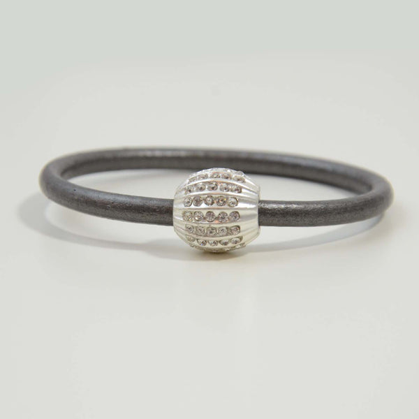 Contemporary oval groove component on leather bracelet