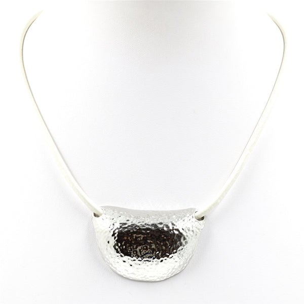 Contemporary half moon beaten pendant on leather